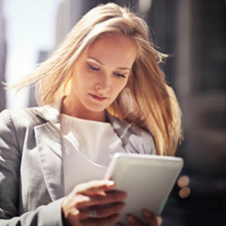 woman-working-tablet-with-city-c